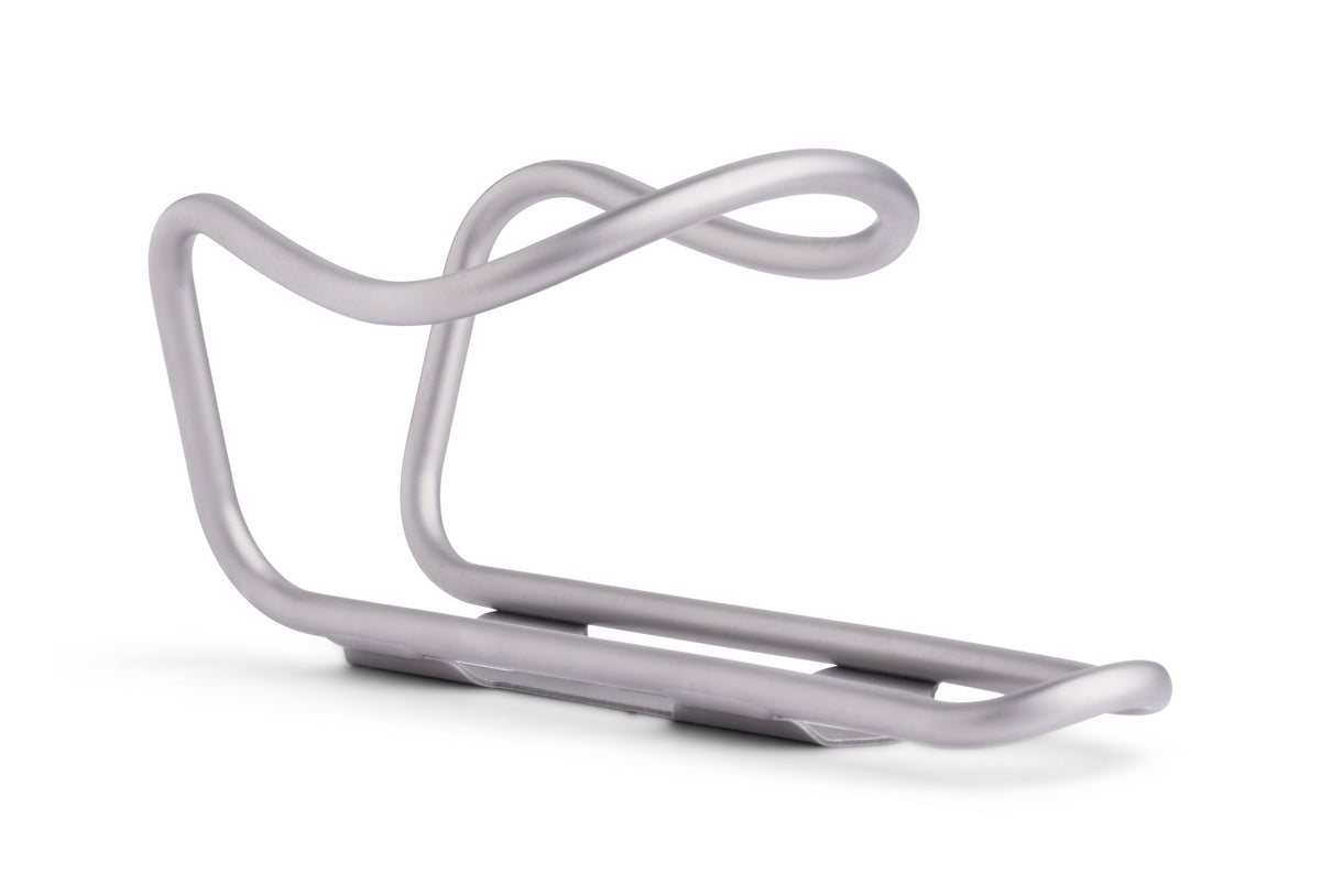 A silver metallic bicycle water bottle cage with a curved, looped top design, shown on a clean white background.