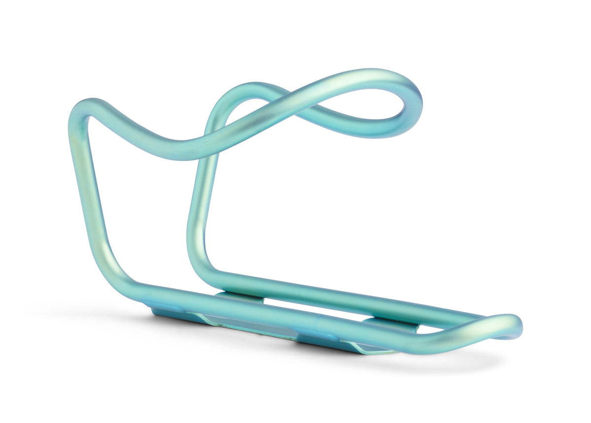 A mint green bicycle water bottle cage on a clean white background.