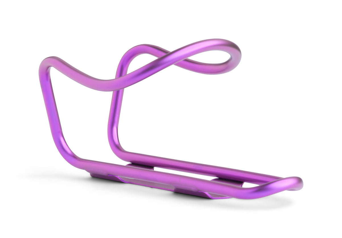 A metallic purple bicycle water bottle cage with a sleek, curved design, shown on a clean white background.