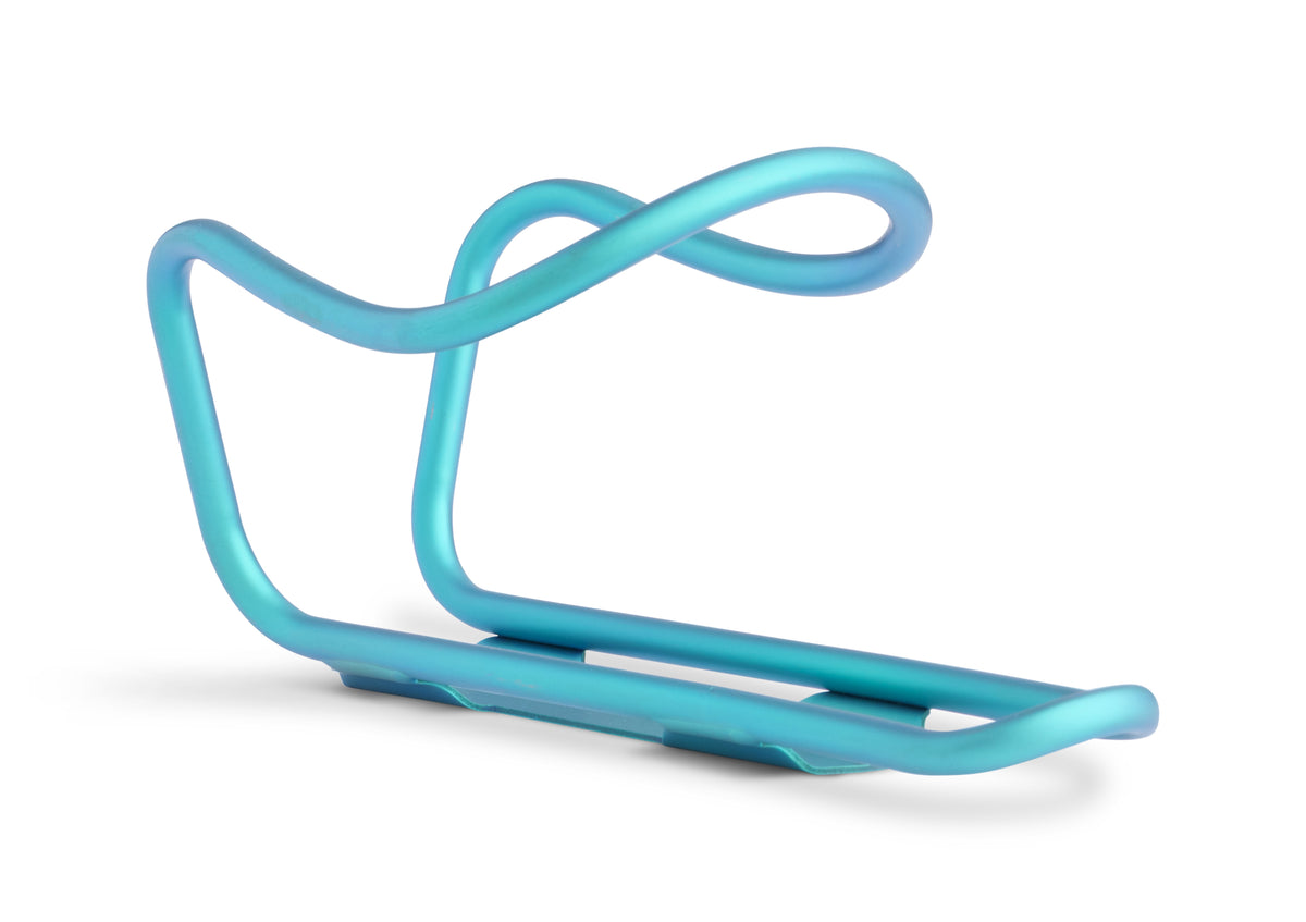 A light blue bicycle water bottle cage with a curved, looped top design, shown on a clean white background.