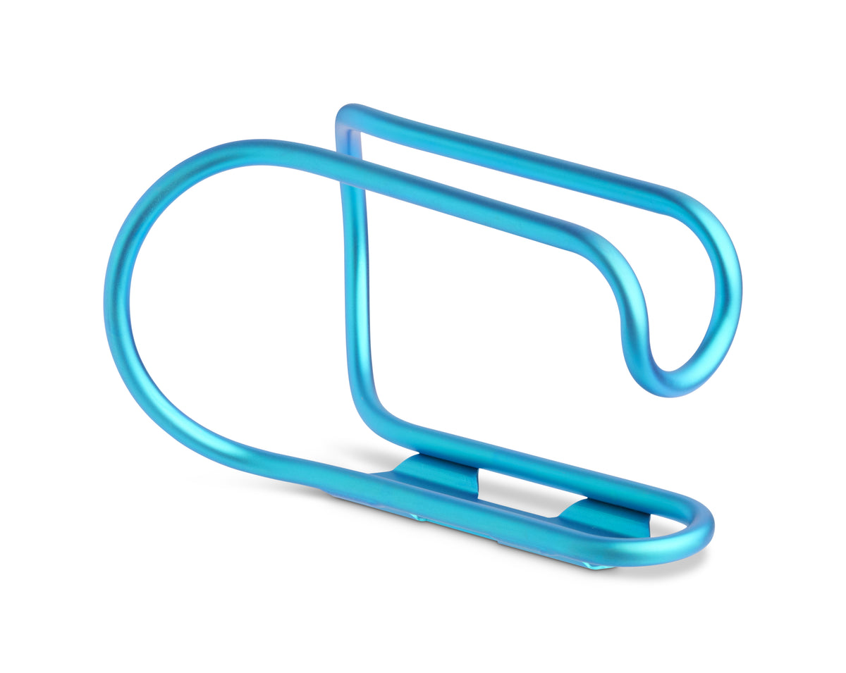 A metallic blue bicycle bottle cage, shown from a three-quarters angle on a clean white background.