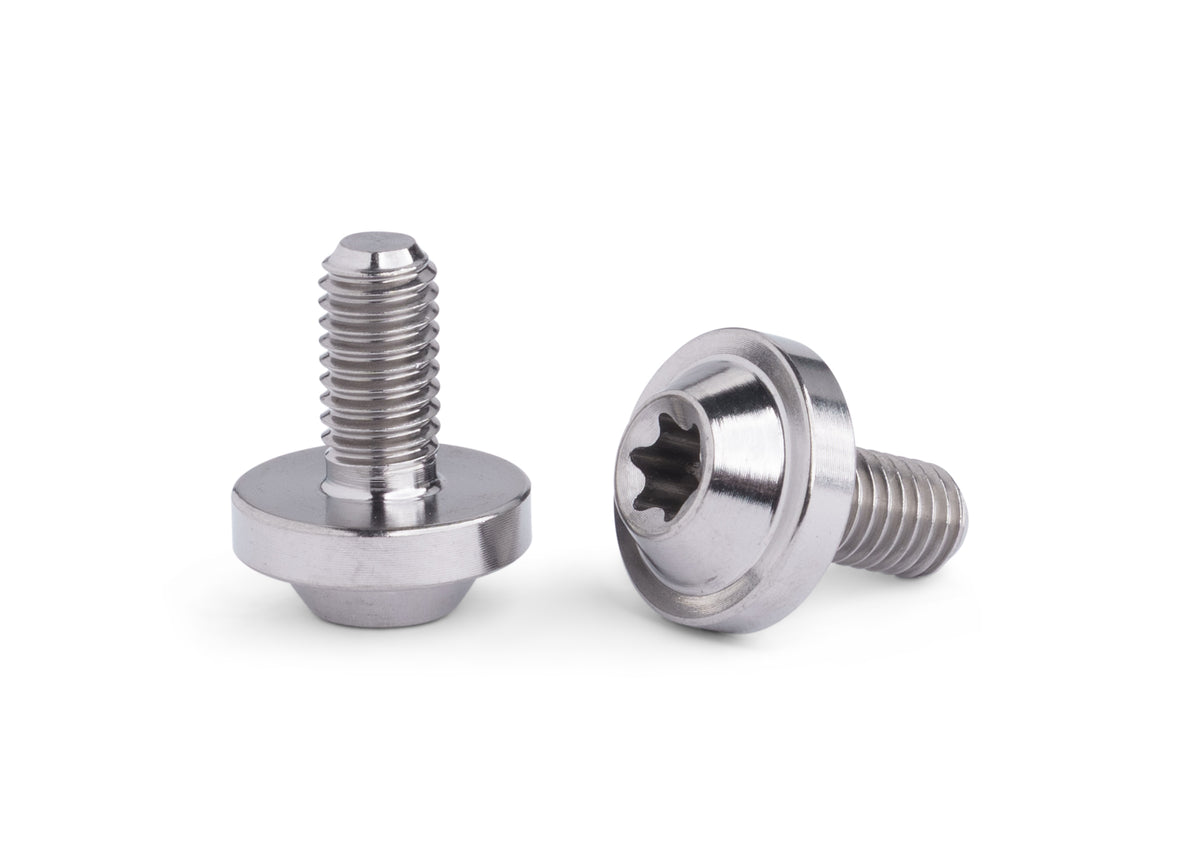 Two metallic flat head screws with a star drive head, shown on a clean white background.